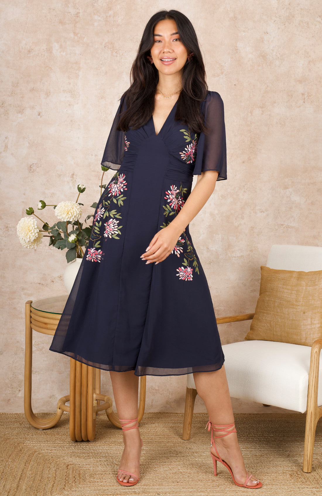 THE TIFFANY EMBROIDERED FLUTTER SLEEVE FRONT PANEL DRESS (NAVY) CURVE